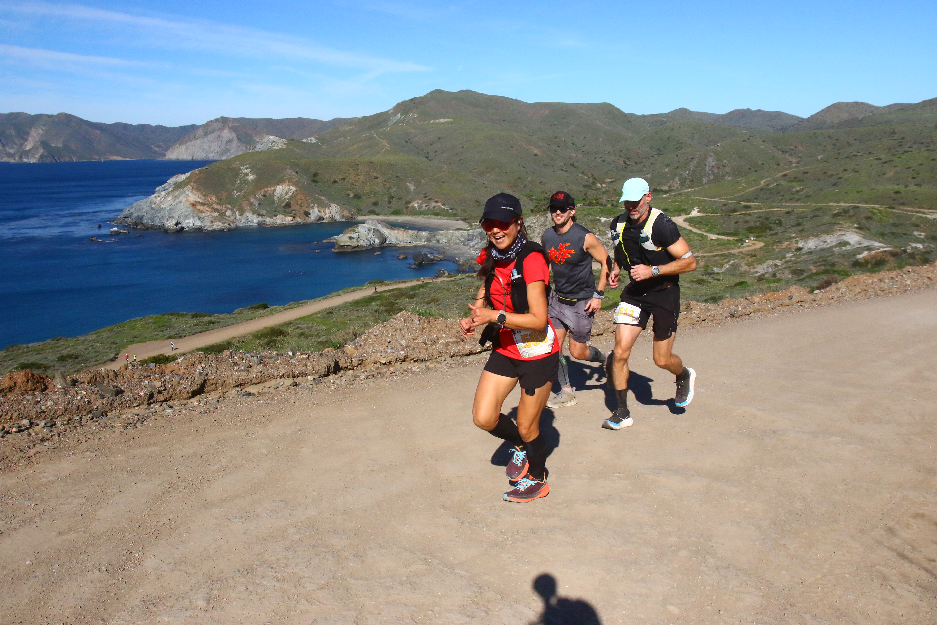 Running with fellow runners along the coast