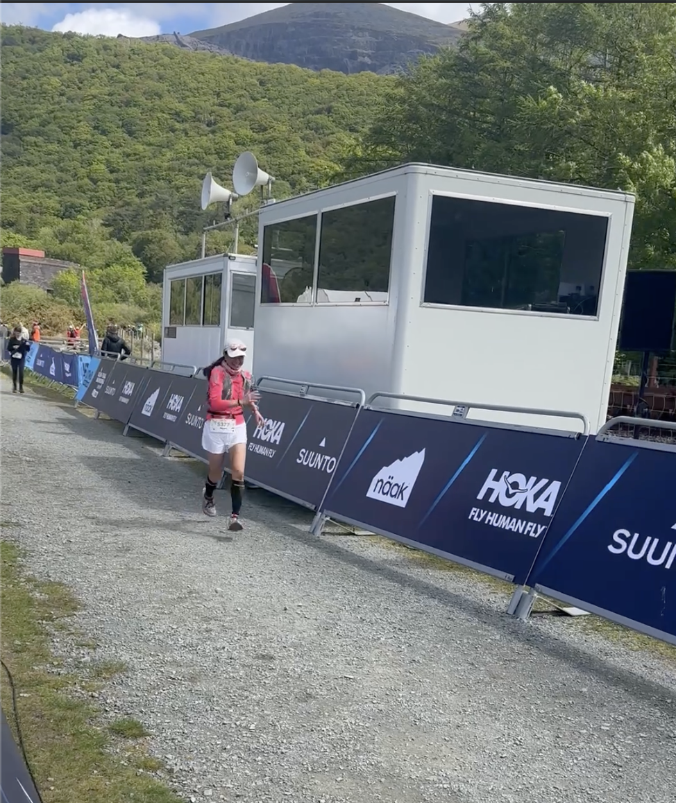 Almost there - grinding toward the finish line with the mountains behind