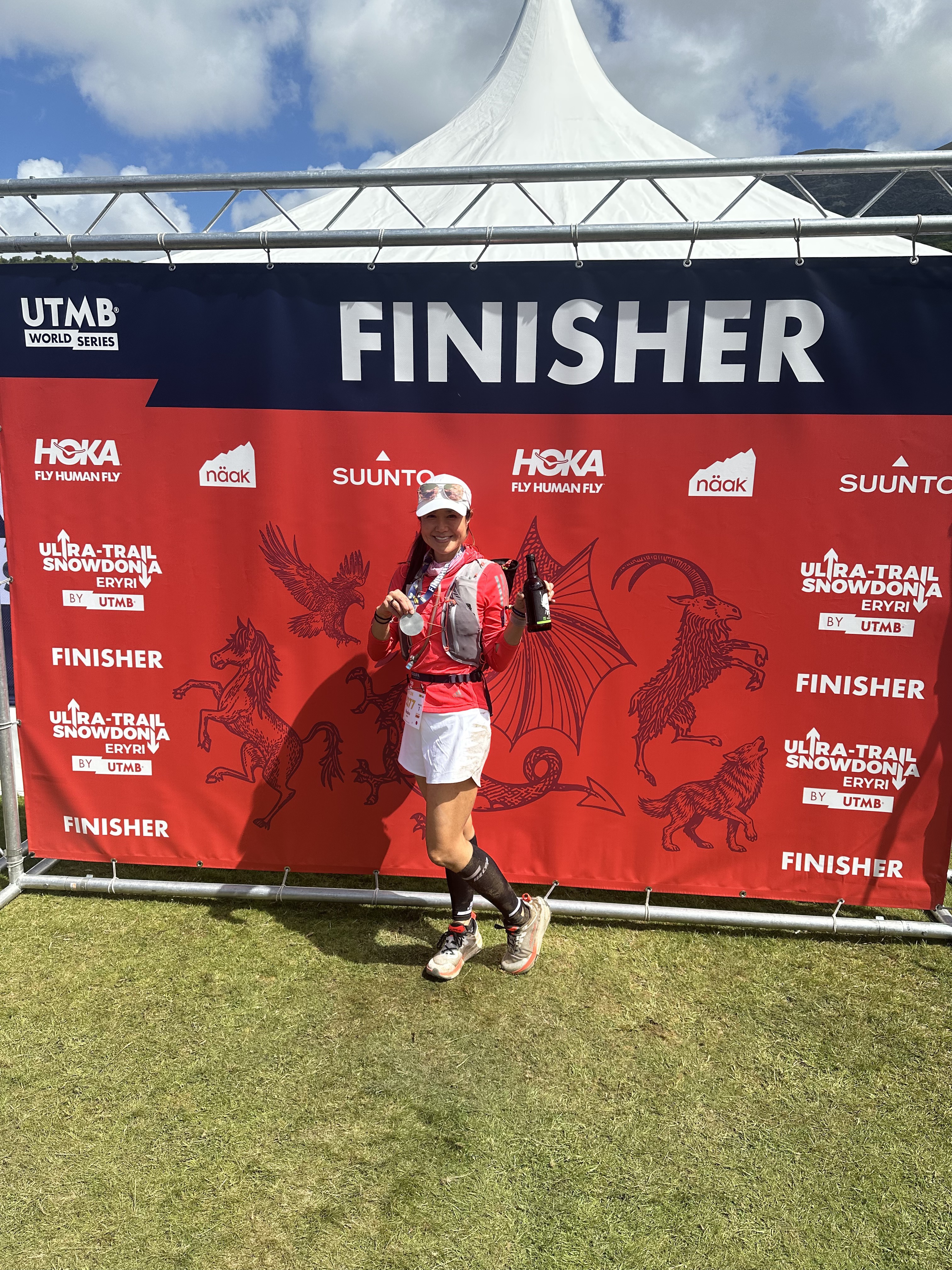 At the finish with my medal - those shoes used to be white
