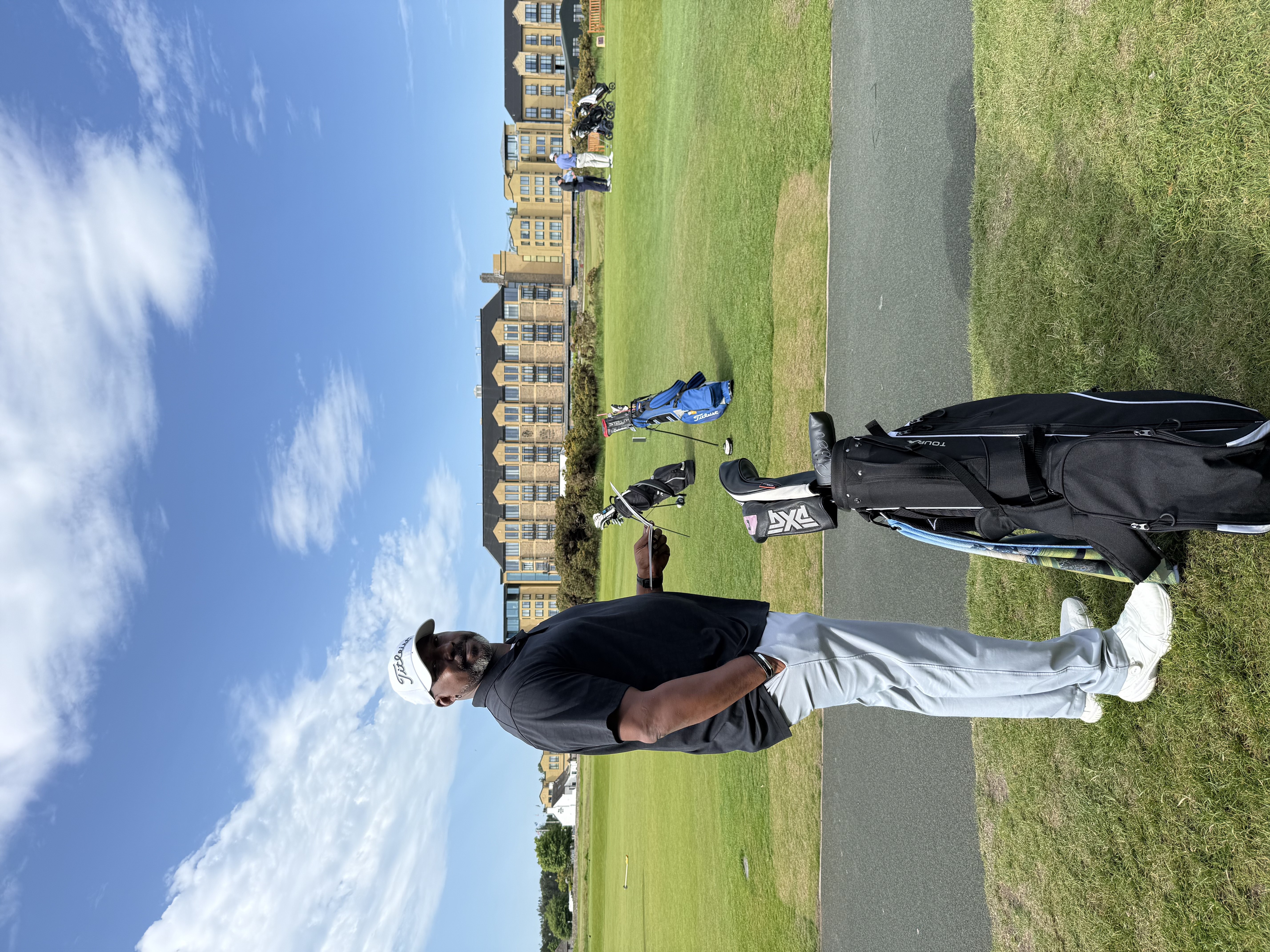 Ready to play, the Old Course Hotel behind him
